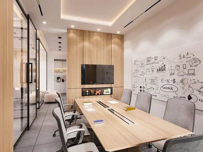 Salle de réunion avec une grande table en bois